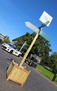 Planter finger wayfinding signage